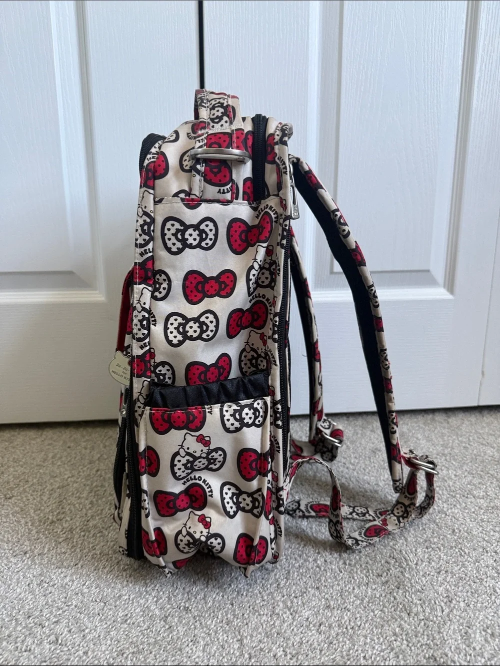 Ju-Ju-Be Hello Kitty Cream Backpack with Red & Black Bow Print
